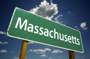 Massachusetts Road Sign with dramatic clouds and sky.
