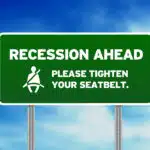Green Road Sign - Recession Ahead. how to pick the best recession proof stocks.