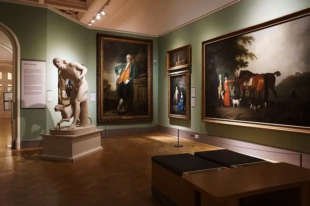 Interior of an art gallery with paintings hanging on the wall