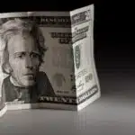 Twenty Bucks in the Dark. Twenty American Dollars Bill. Horizontal Studio Photo.