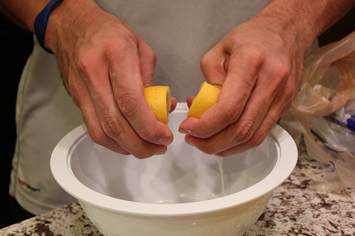 Squeezing lemons for chicken piccata recipe